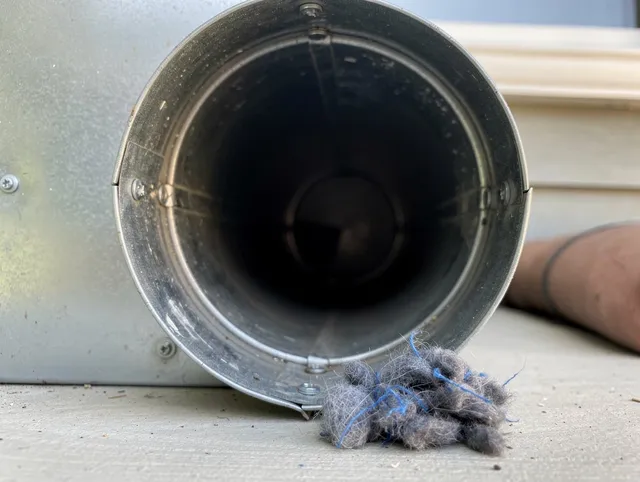 Covina Dryer Vent Cleaning technician using specialized equipment to clear severe dryer vent blockage in Covina